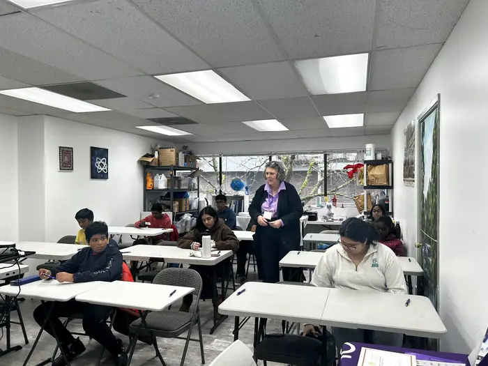 Students seated at tables across a classroom during the January 2026 Brain Challenge.