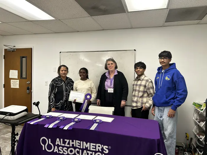Competitors and organisers gathered behind the Alzheimer's Association table.