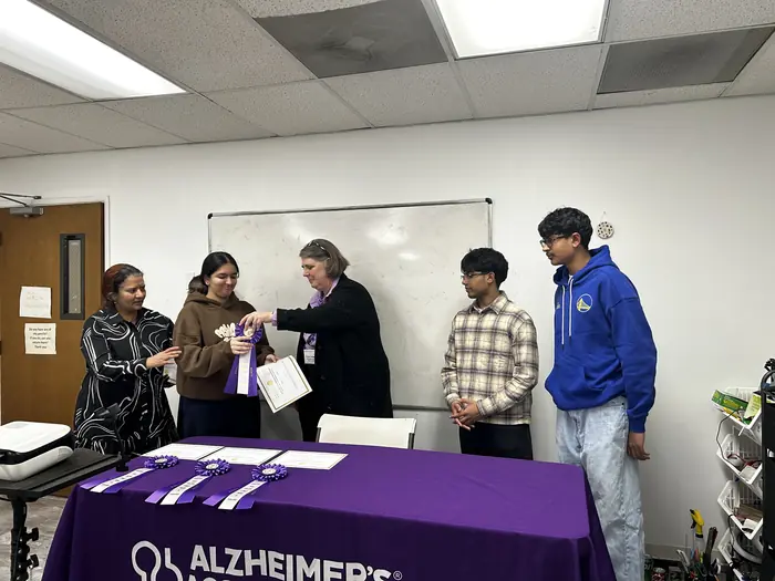 Participants and organisers gathered around the Alzheimer's Association table.