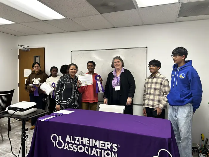 A group of participants holding certificates after the awards.